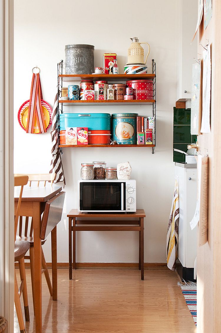 Unique storage features add to the allure of the shabby chic kitchen [Photography: Hilda Grahnat]