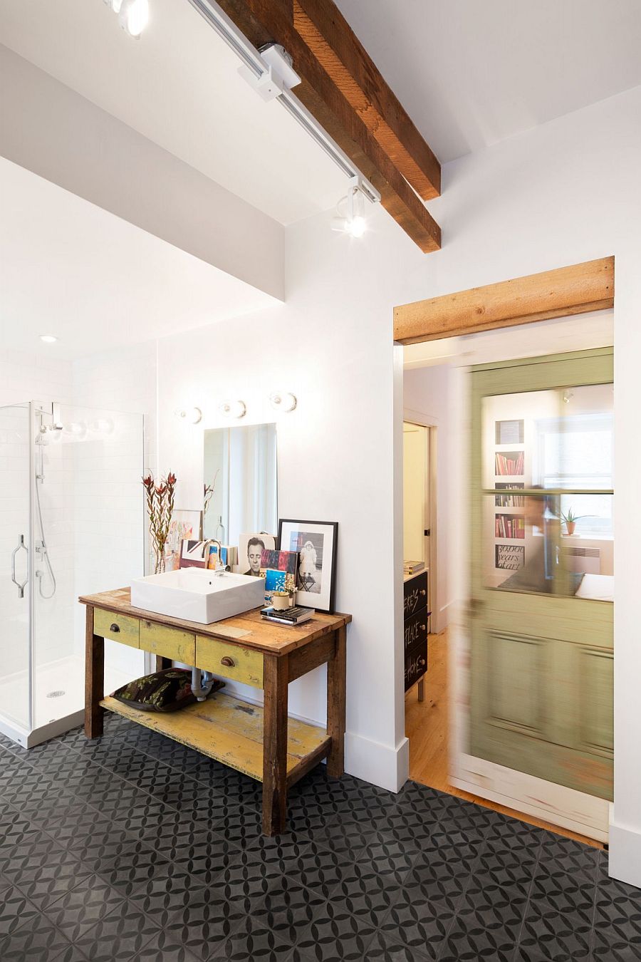 Weathered table adds antique beauty to the contemporary master bathroom