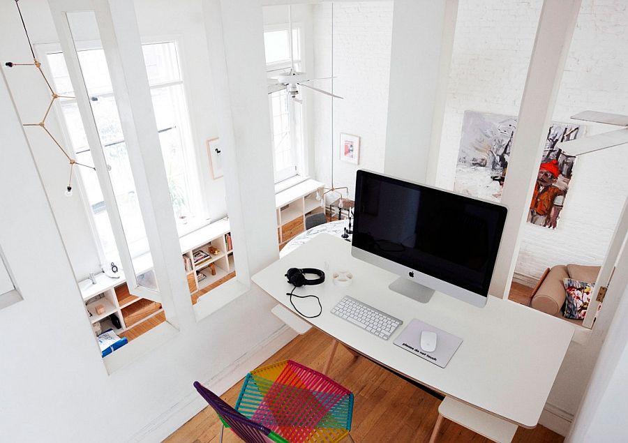 Workspace on the mezznine level with a view of the lower dining space and kitchen