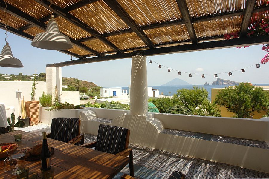 A fusion of Mediterranean sunroom and rooftop deck