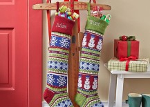 A-sled-holding-two-Christmas-stockings-217x155