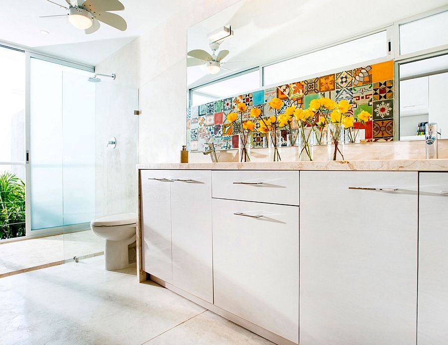 An eclectic collection of colorful tiles also make an appearance in the bathroom