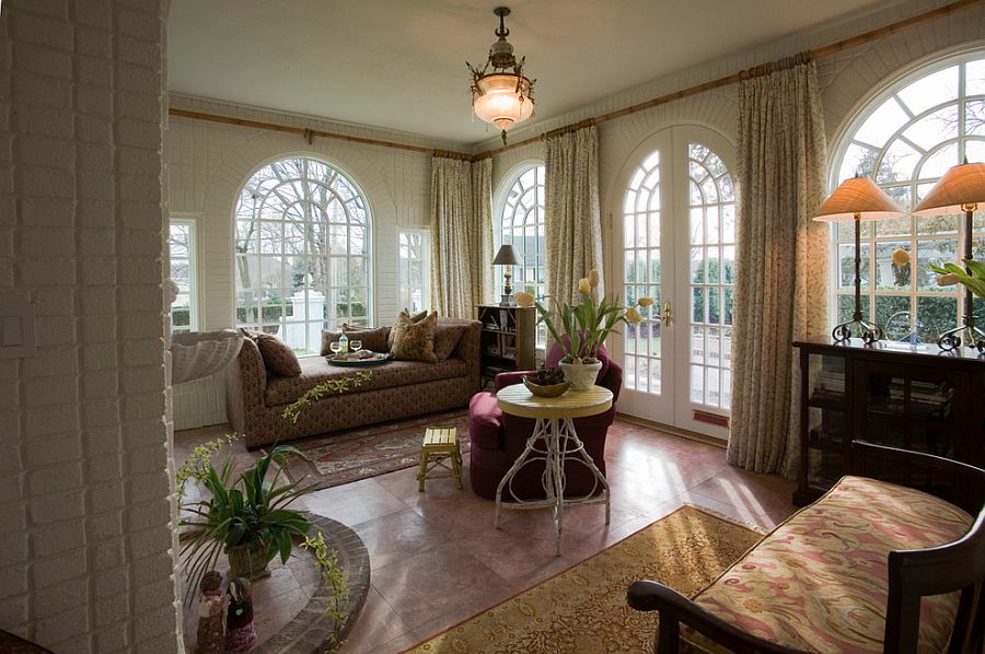 Arched dooorways, heated marble floor and cozy seating for the opulent sunroom [Design: Designs By Jennifer Owen]