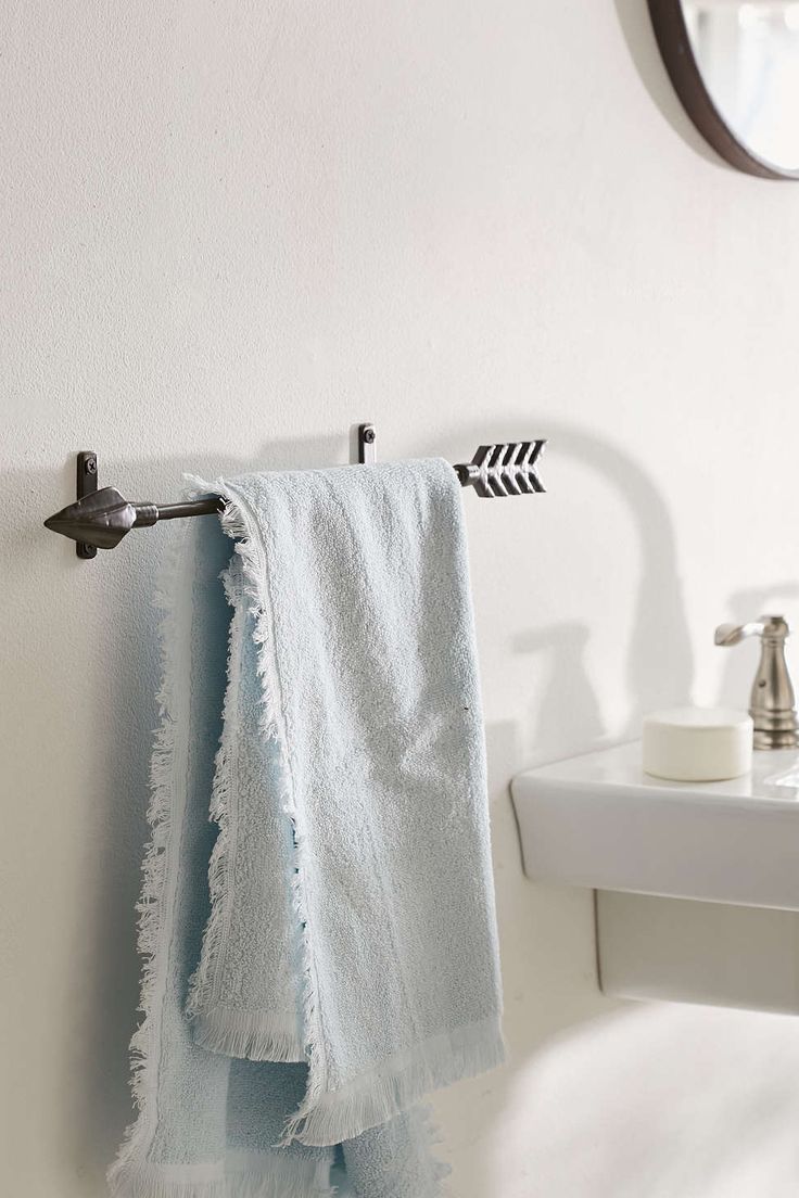 Arrow towel rack in a bathroom