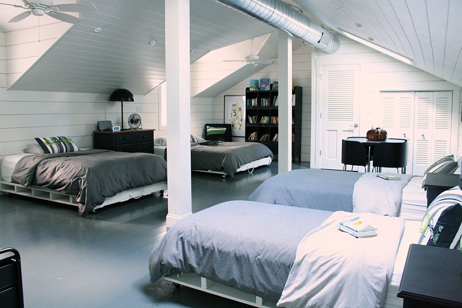 Attic bedroom with multiple beds on casters [Photography: Mina Brinkey]