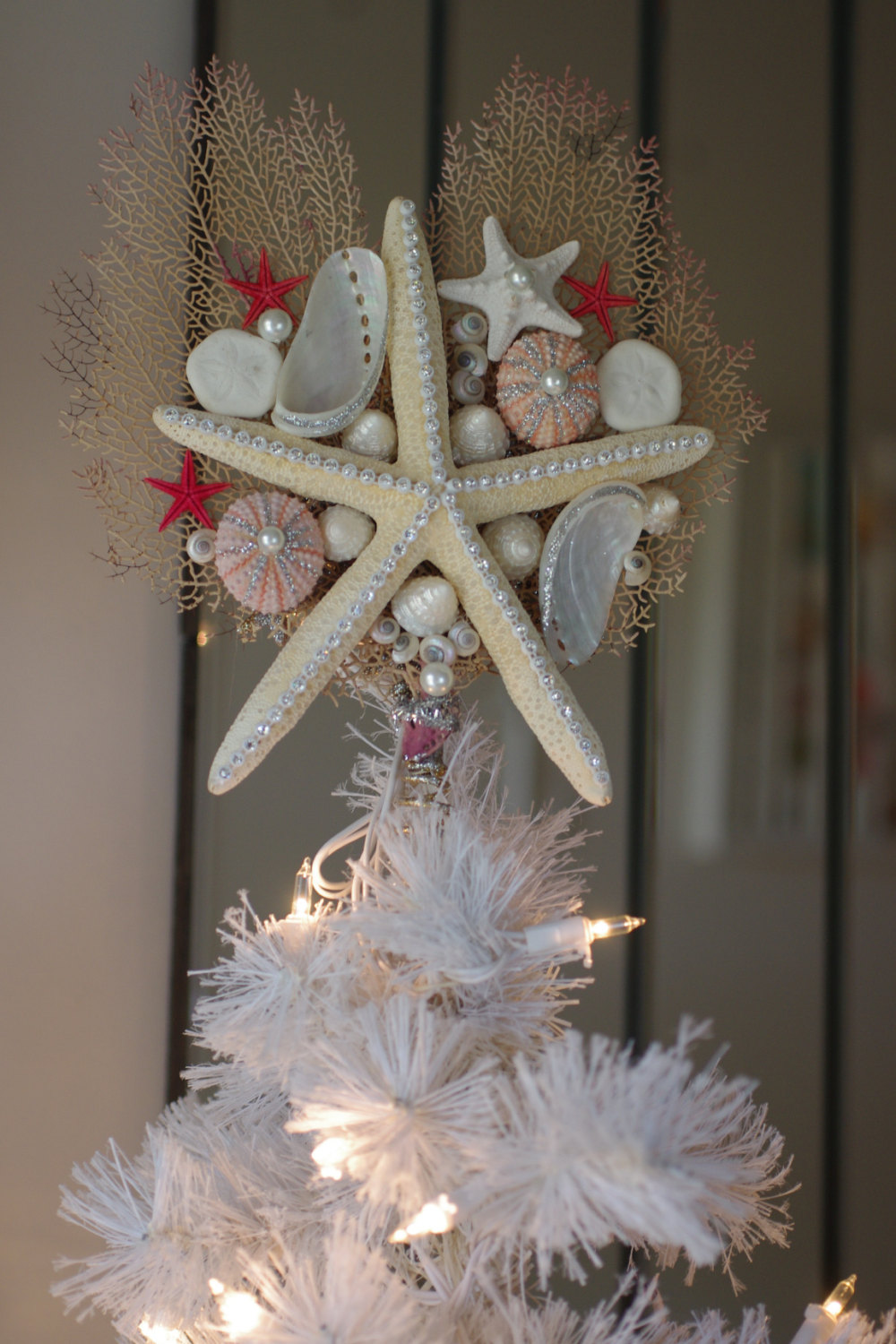 Beautiful white starfish tree topper with sea urchin and seashells