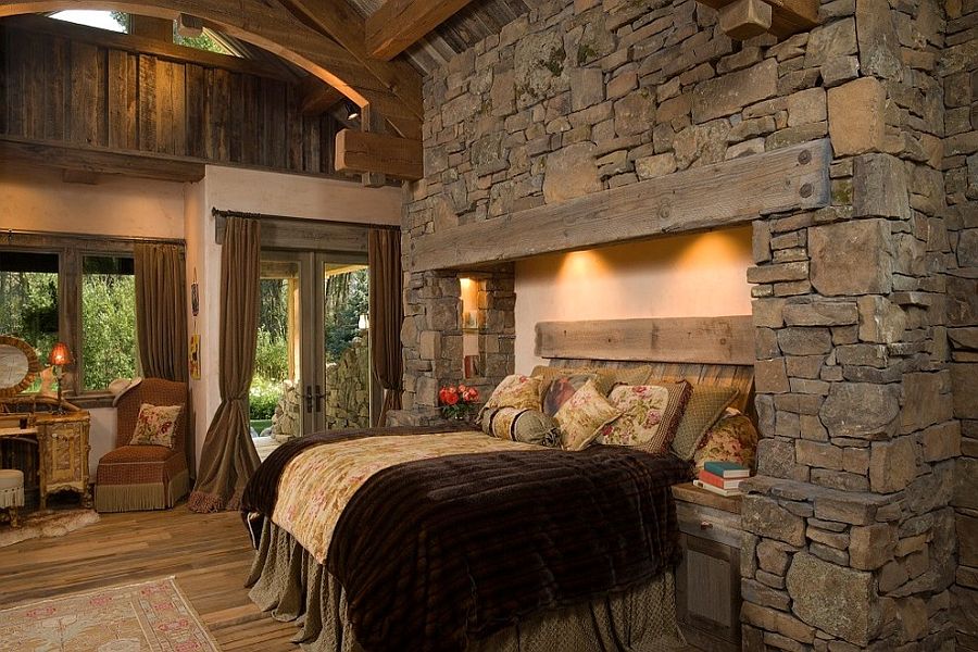 Bed recessed into the stone wall with fuzzy lighting