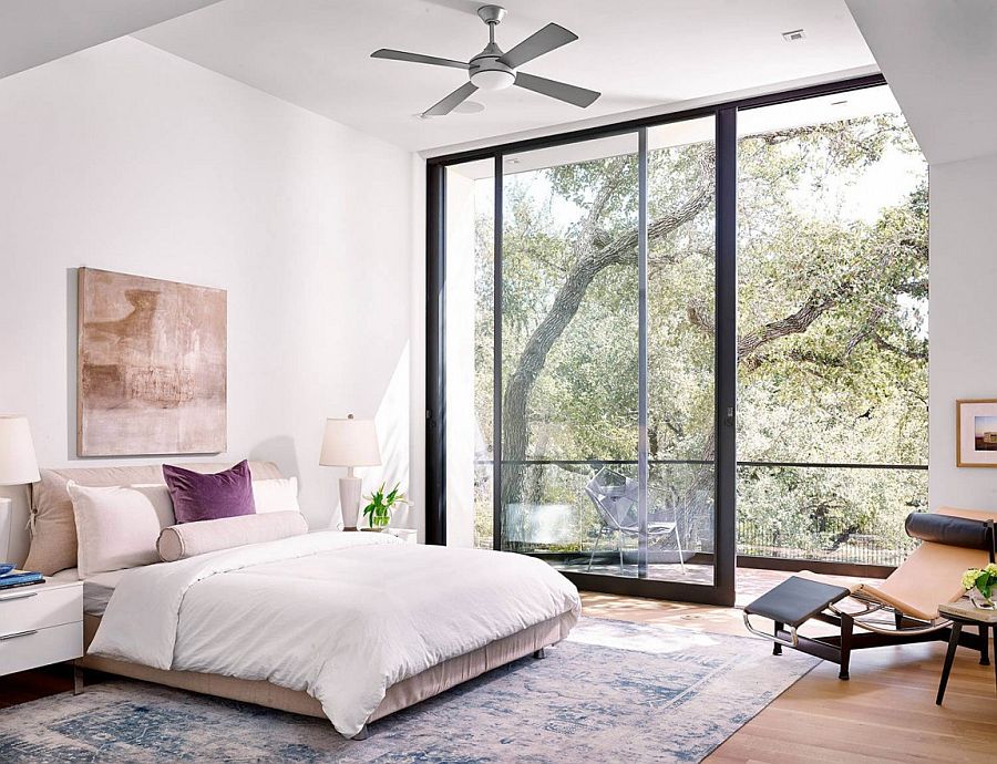 Bedroom with a small balcony and plush decor