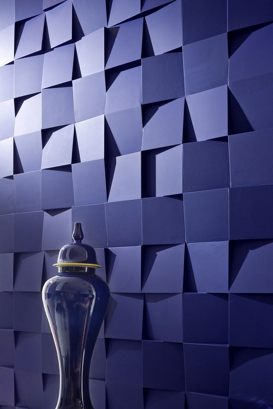 Bespoke 3D wall panels designed by Sergey Makhno steal the show inside this small Kiev apartment