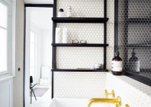 Black-shelves-installed-on-wall-beside-bathtub-in-Parisian-apartment-217x155