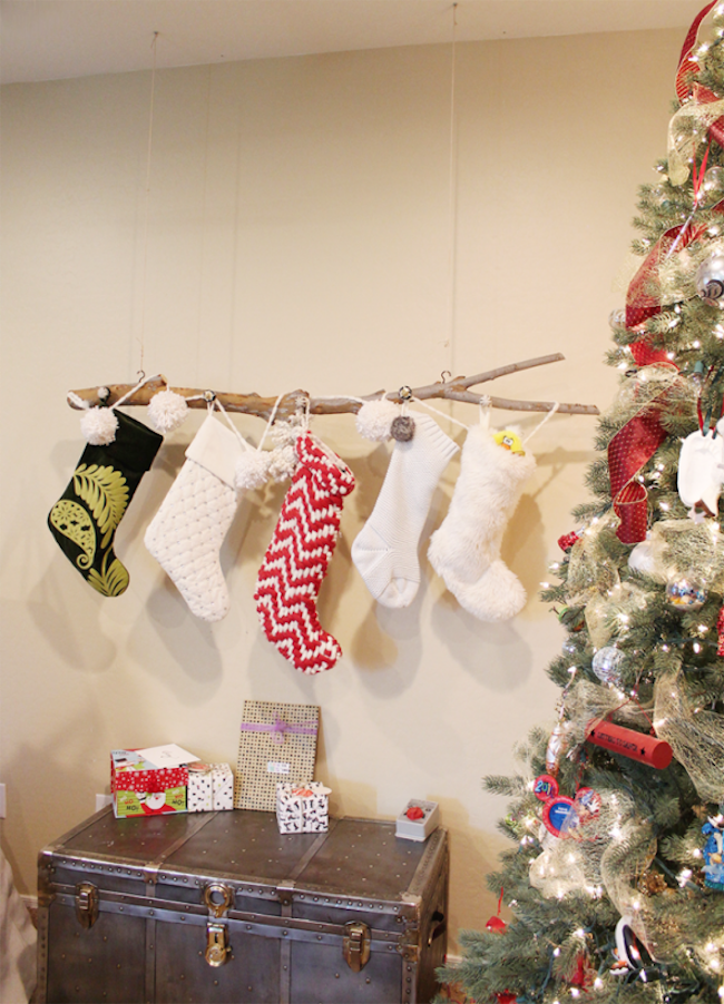 Branch hung from the ceiling to hold stockings