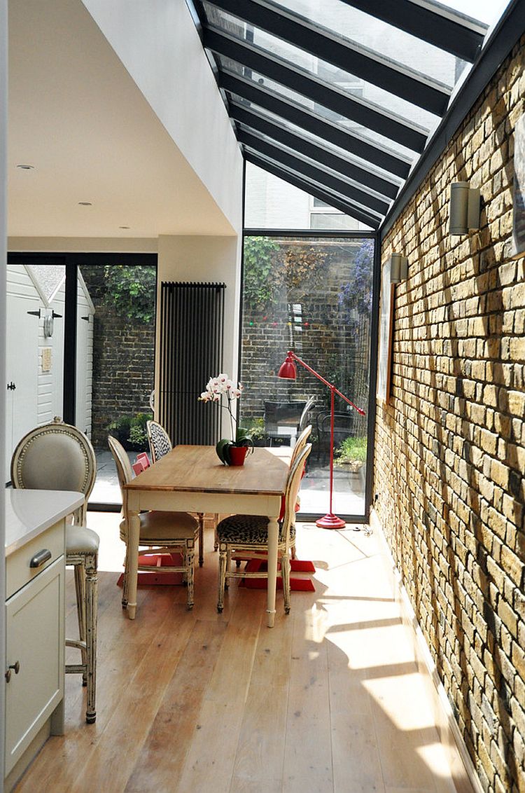 Brick wall extension with a glass roof is a popular choice for a small and cheerful dining space