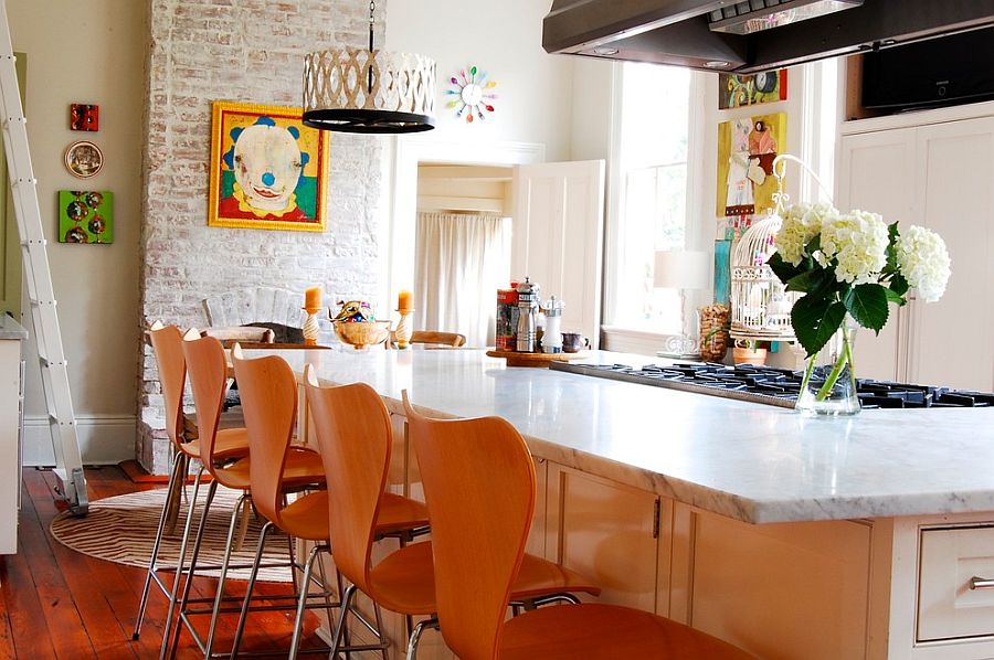 Brick wall fireplace becomes a focal point in the colorful, eclectic kitchen [Photography: Corynne Pless]