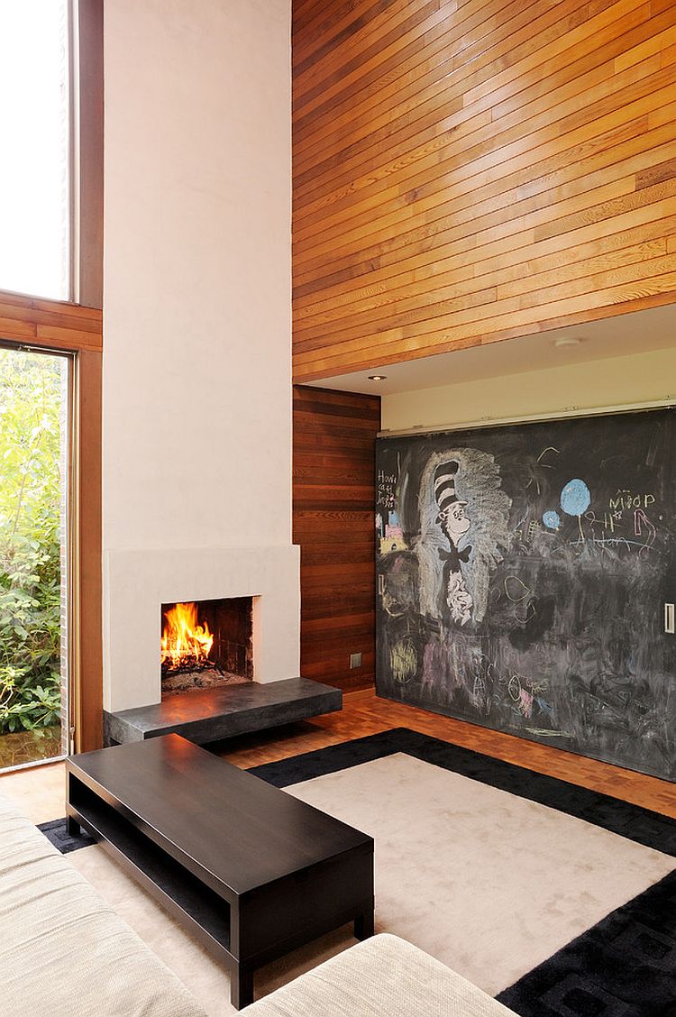 Chalkboard sliding door conceals the media unit