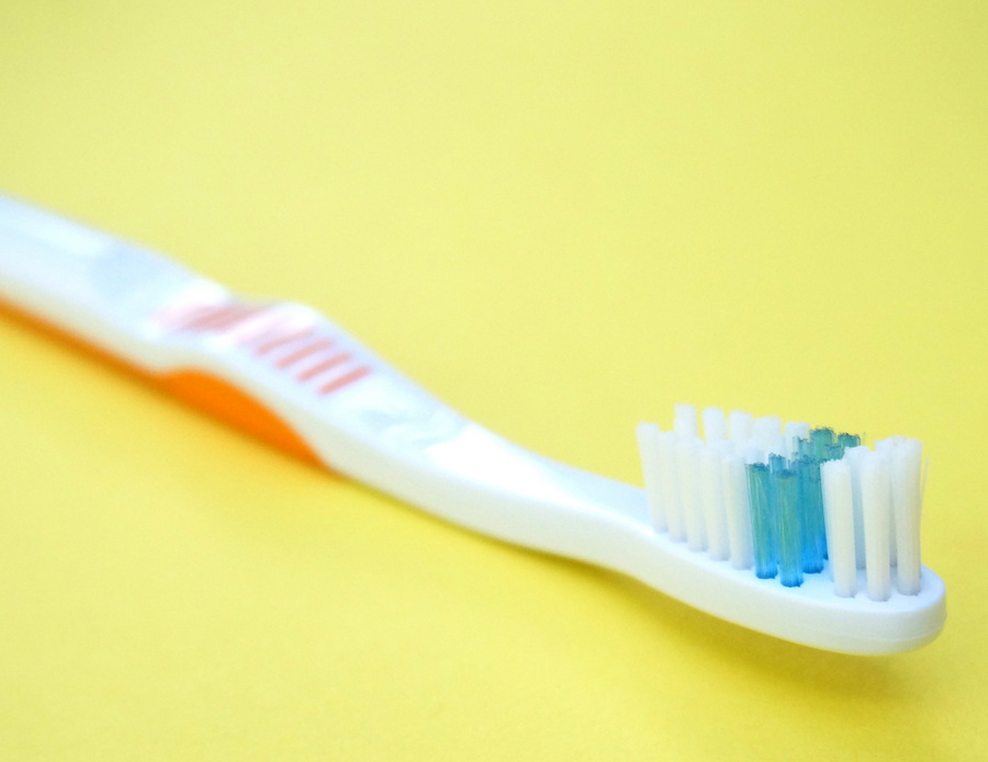 Clean your grout with a toothbrush