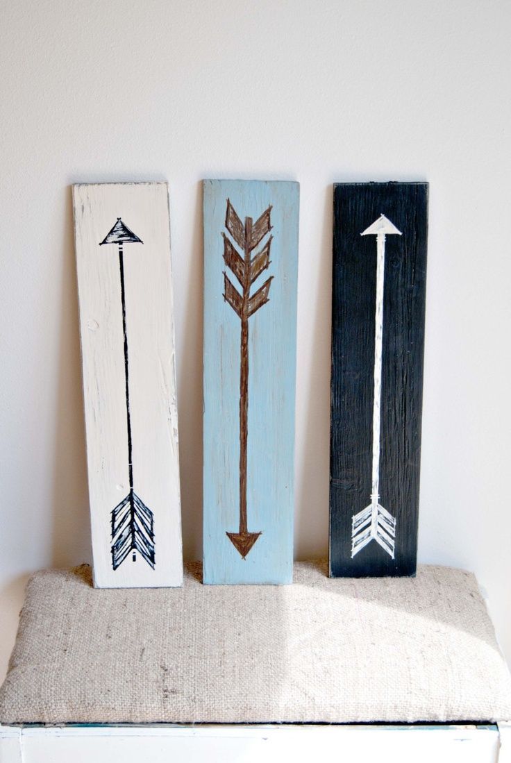 Collection of three simple and colorful arrow wall art pieces