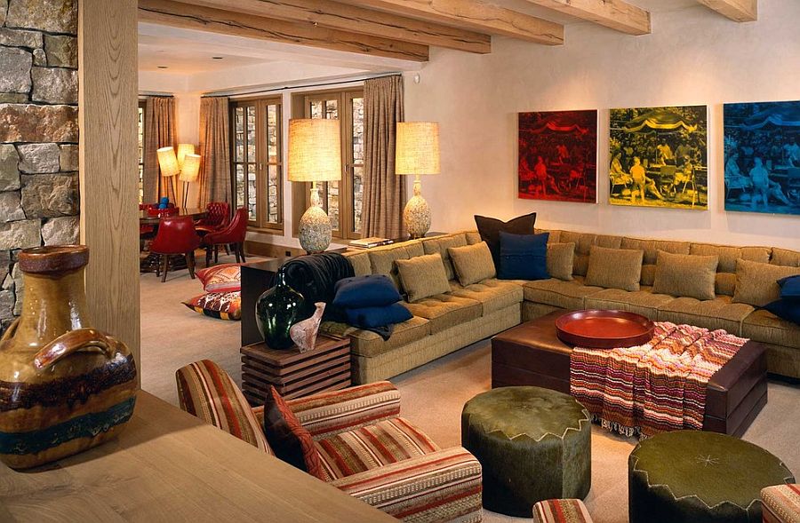 Colorful prints in the backdrop enliven the rustic family room