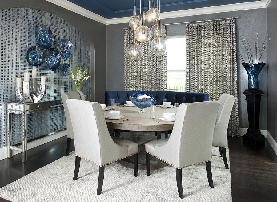 Contemporary dining room with a splash of blue, gray and a light colored rug