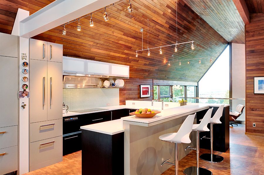 Contemporary kitchen in white sits at the heart of the modcentury modern remodel