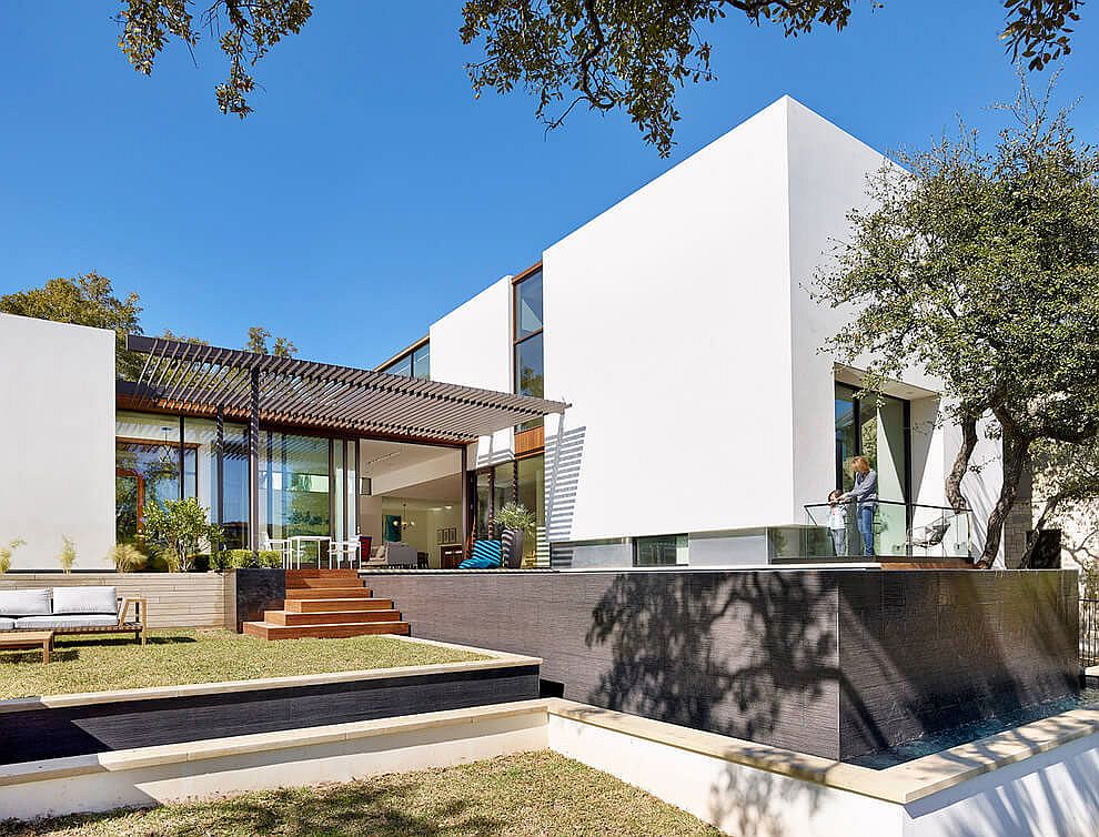 Contemporary private home in Austin with a negative edge pool and a lovely rear yard