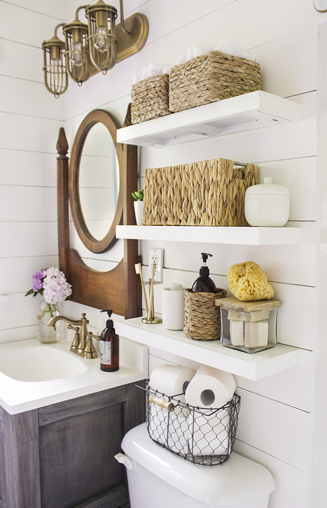 Country bathroom with shelves installed above toilet