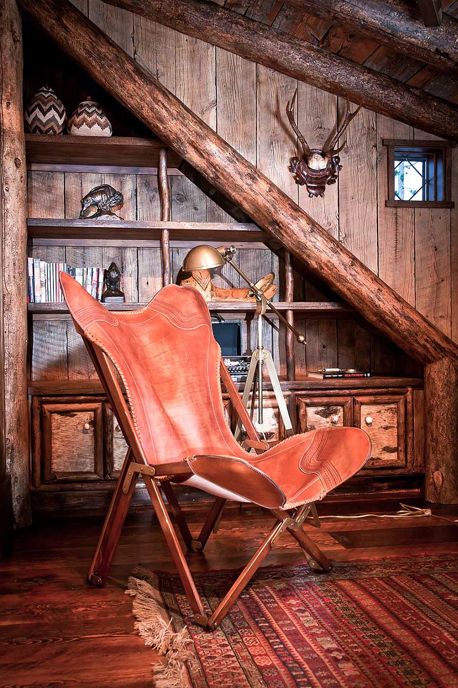 Cozy reading nook with comfy chair and cuztom bookshelf