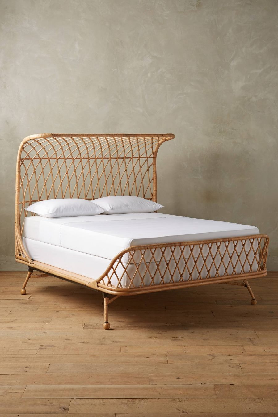 Curved rattan bed from Anthropologie