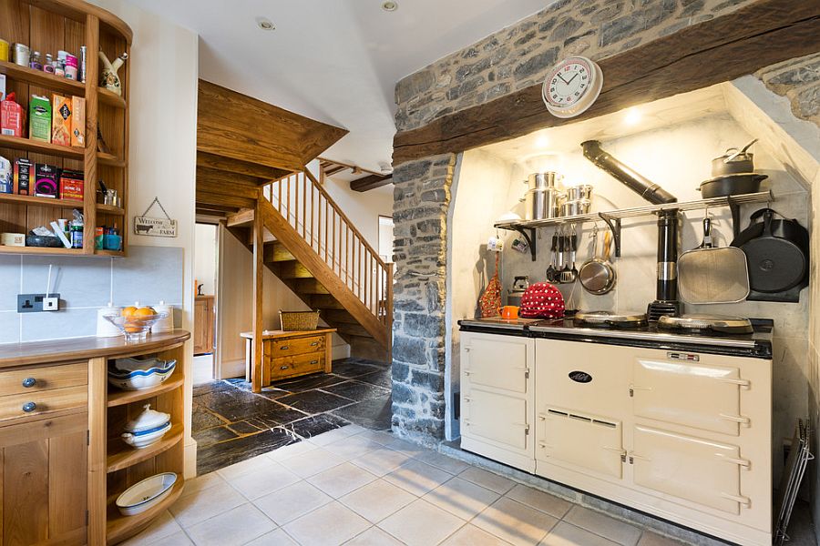 Custom kitchen design with exposed stone feature and small workstation