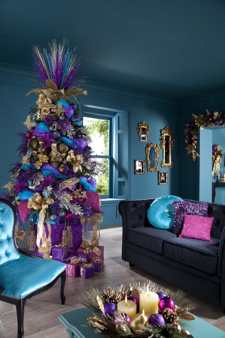 Dramatic tree topper in gold, purple, and blue