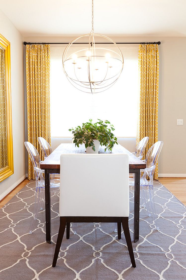 Drapes and rug add yellow and gray to the neutral dining room