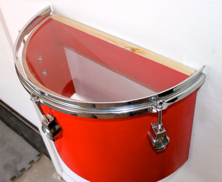 Drum cut in half to make a shelf