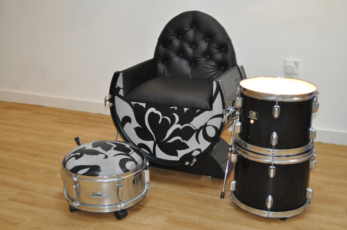 Drums repurposed as a chair and ottoman