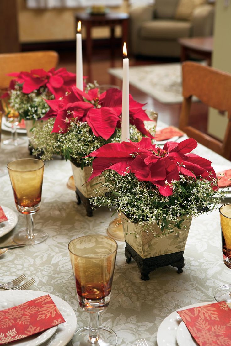 Elegant poinsettia and candlestick centerpieces