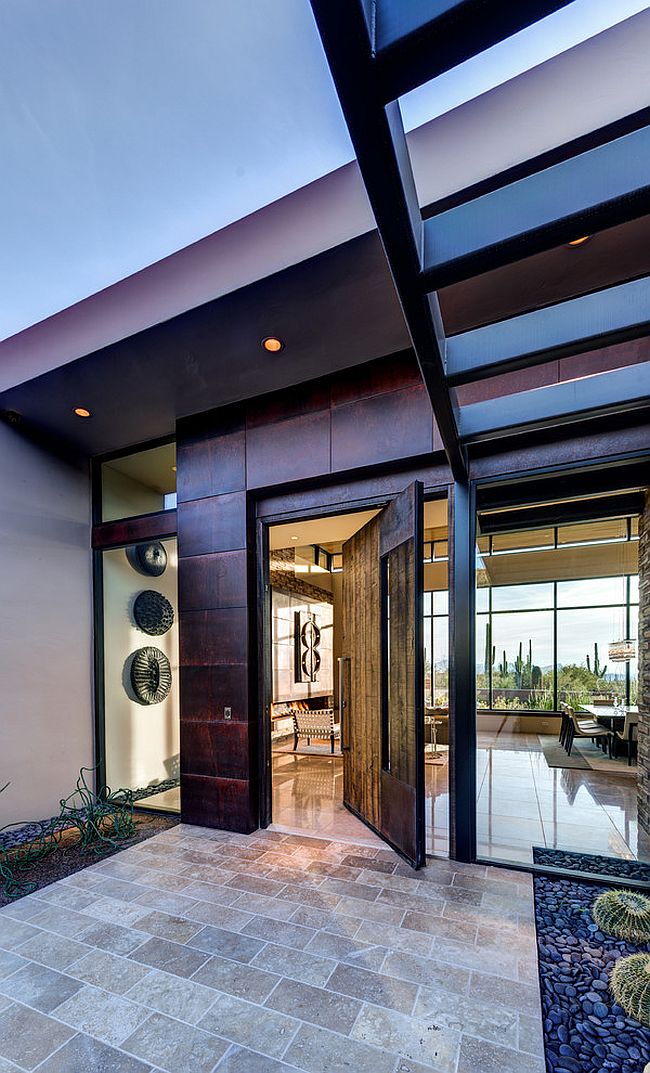 Entrance of the desert home with a swivel door