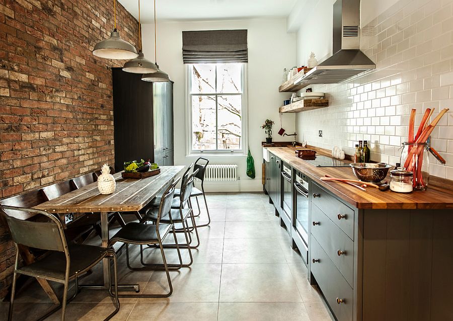 Exposed brickwork, tile and gray cabinets for a loft style kitchen with space-savvy design [Design: Compass and Rose]