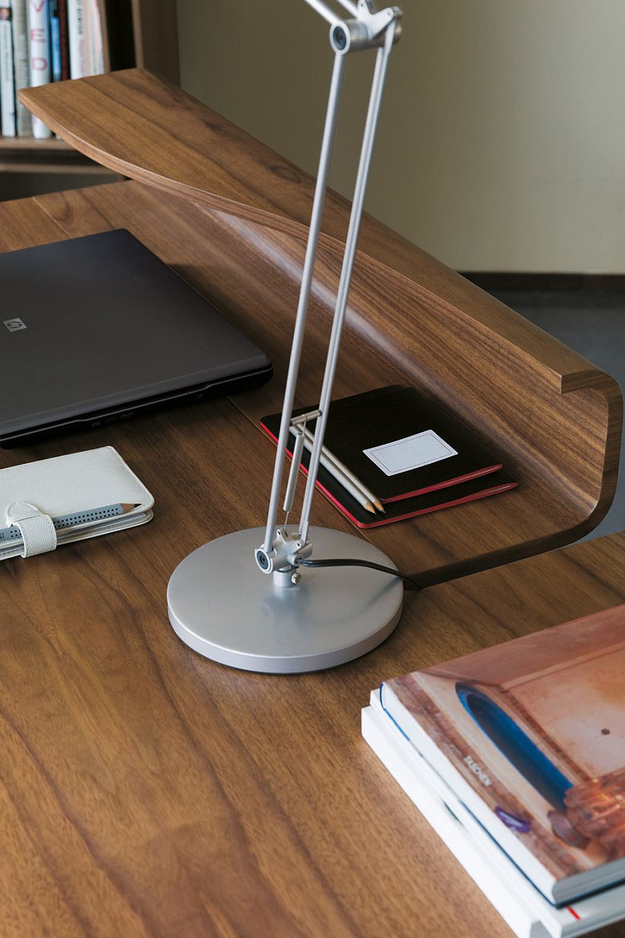 Exqusite design of office desk in walnut keeps things classic and simple