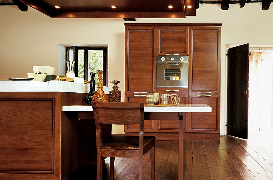 Extended dining table attached to the kitchen island offers a smart breakfast zone