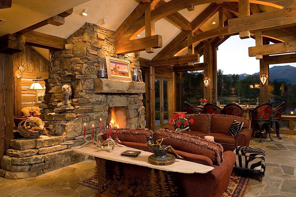 Family room with glass walls and stone fireplace at its heart