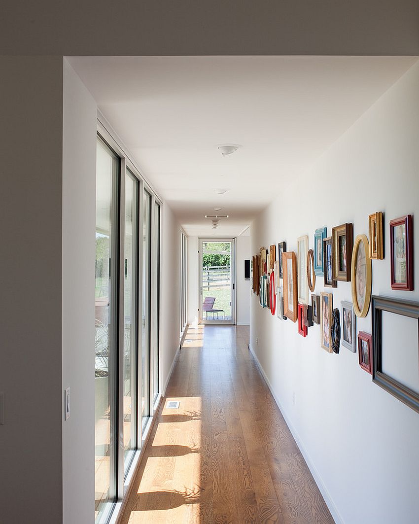 Gallery wall is filled with both framed pictures and a few empty frames