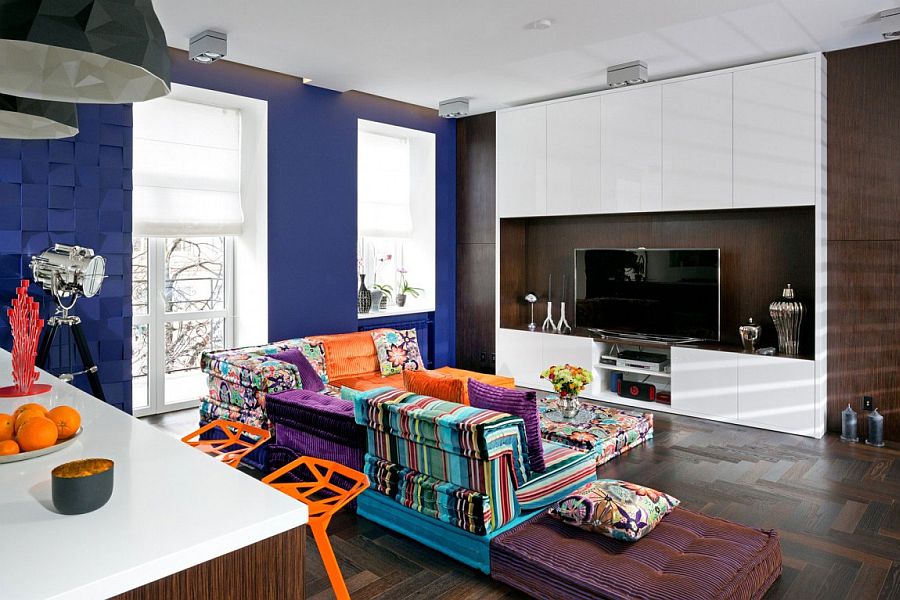 Gorgeous and colorful modular sofa by Roche Bobois sits at the heart of the home theatre guest room