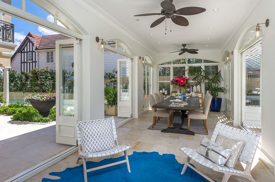 Gorgeous sunroom in white with a hint of blue [Design: Danka Interiors]