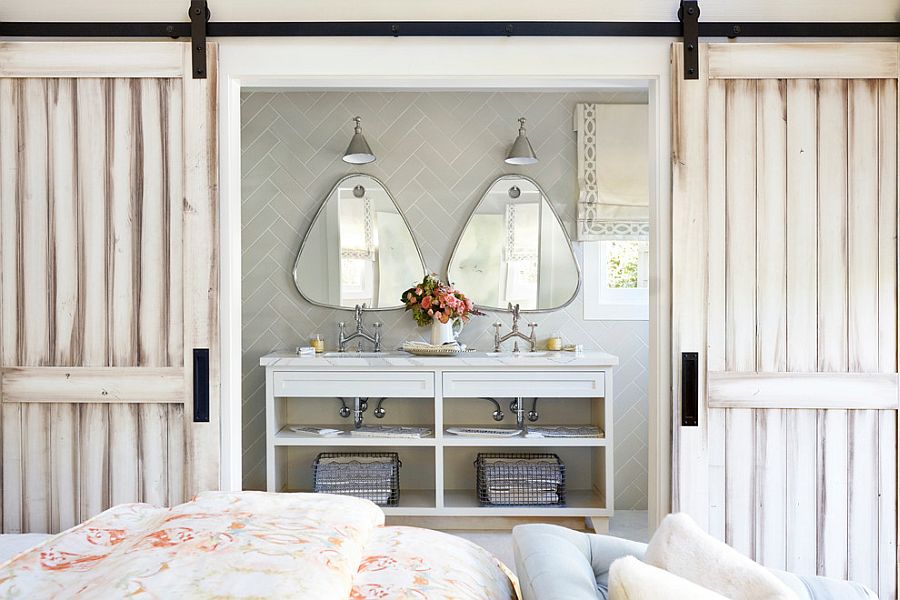 Herringbone pattern backsplash in bathroom with sliding barn doors