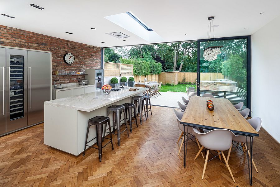 Herringbone pattren flooring and brick wall backsplash in the modern kitchen