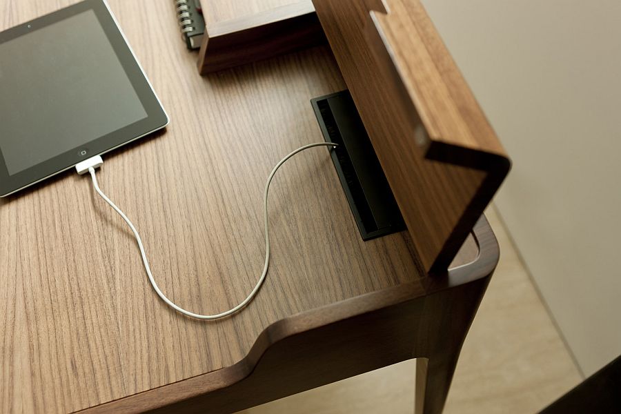 Hidden compartments help you tuck away the wires and provide an ergonomic work desk