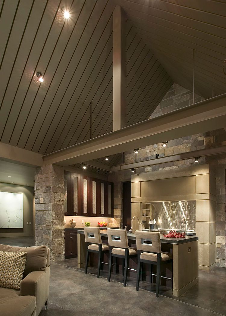 Hue of the natural stone blends in with the visual of the gray vaulted ceiling