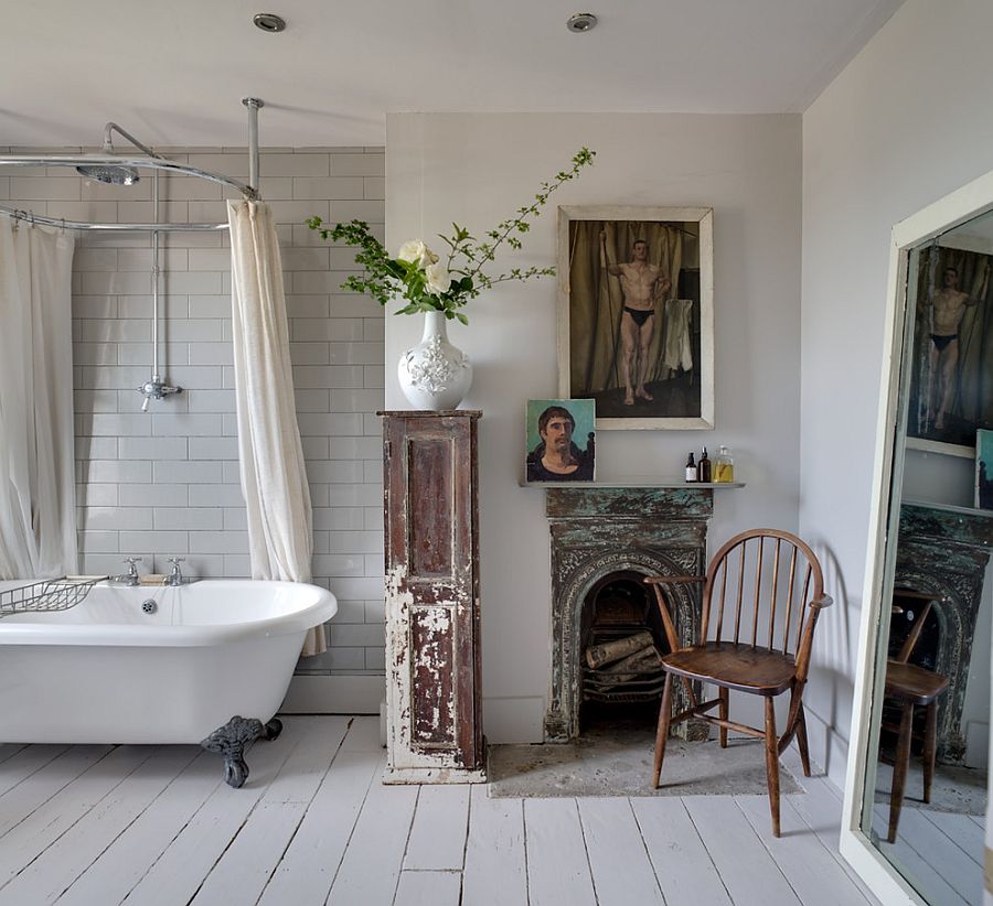 Interesting art work and clawfoot bathtub for the shabby chic bathroom