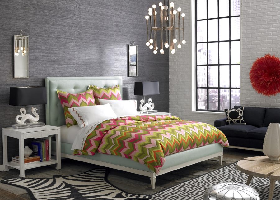 Jonathan Adler bed with a tufted headboard