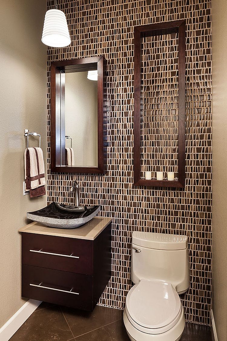 Large empty frame offers tiny shelf space for candles in the powder room!