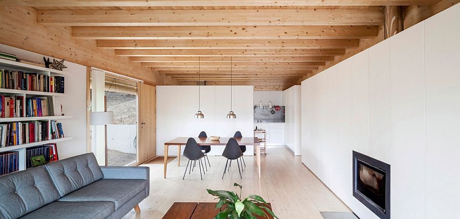 Living room with white walls and woodsy ceiling