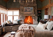 Lovely-stone-wall-fireplace-and-window-seat-enhance-the-woodsy-cabin-style-of-the-bedroom-217x155